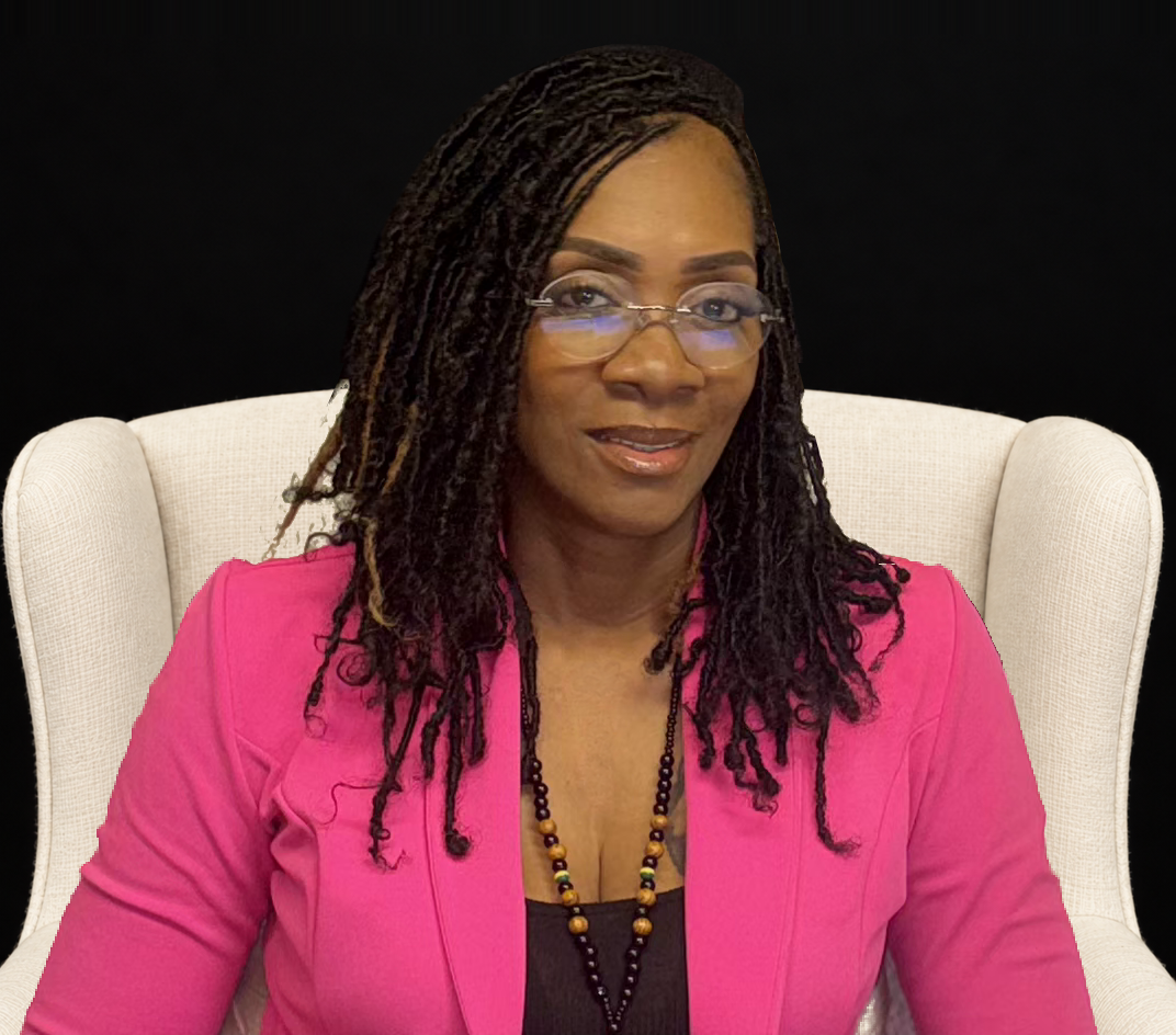 Nikkieda McAlister, founder of Our Hearts Home Healthcare, seated in an ivory armchair, wearing a magenta blazer, against a black background.